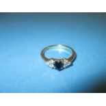 A 9ct gold diamond and sapphire ring, approx. size M