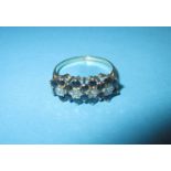 A 9ct gold diamond and sapphire dress ring, approx. size M