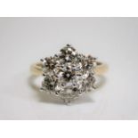 A large 18ct gold seven stone diamond cluster ring