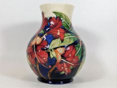 A Moorcroft pottery vase approx. 9.5in of floral d