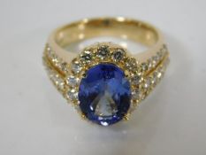 A large 14ct gold diamond & tanzanite ring
