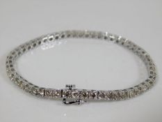A white metal diamond line bracelet approx. 7.1ct