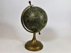 A small vintage globe marked to verso MOD. DEP.