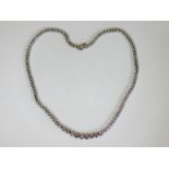 A ladies boxed white metal diamond necklace with a