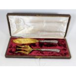 A boxed set of silver & gilt French fish servers