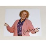 A hand signed Catherine Tate photograph as acquire