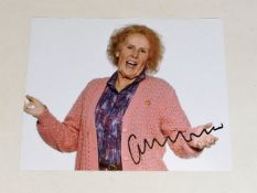 A hand signed Catherine Tate photograph as acquire