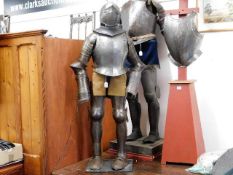 A 19thC. childs suit of armour mounted on plinth