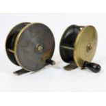 A pair of antique brass fishing reels