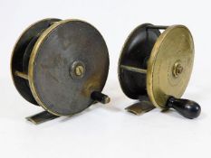 A pair of antique brass fishing reels
