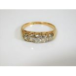 An 18ct gold five stone old cut diamond ring appro
