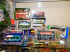 A collection of twelve boxed Corgi buses & similar