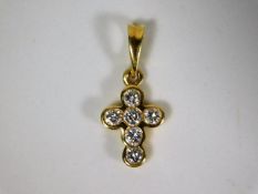 An 18ct gold cross set with approx. 0.33ct diamond