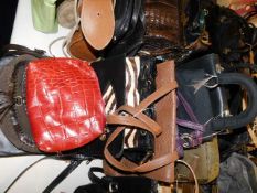 A collection of ten handbags including zebra & ost