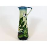 A Moorcroft pottery jug approx. 9.5in with floral