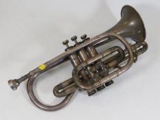 A vintage Besson white metal cornet