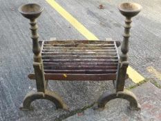 A large pair of antique iron firedogs & grate, app
