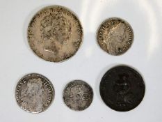 Five coins: a George III penny 1799, a William III silver shilling 1696, a George III LX silver crow