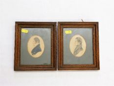 A pair of 19thC. oak framed coloured silhouettes