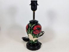 A Moorcroft pottery lamp base approx.12.25in of fl
