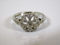 A 9ct white gold ring set with small diamonds
