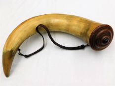 A large 19thC. powder horn with turned wood cover,