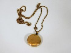 A 9ct chain with rolled gold locket