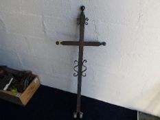 A large antique iron cross given by artist Robert