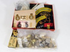 A boxed quantity of mostly army badges & related i