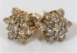 A pair of 14ct gold & diamond earrings of approx. 1.5cts