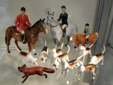 A Beswick hunting group with three horse riders, e