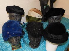 Six vintage hats with stands