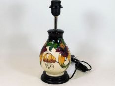 A Moorcroft pottery lamp base Anna Lily by Nicola
