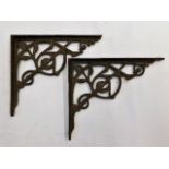 A pair of Victorian cast iron brackets approx 8in