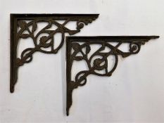 A pair of Victorian cast iron brackets approx 8in