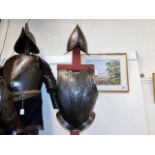 An Italian suit of armour including gloves with pl