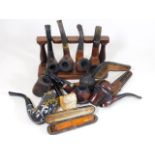 A selection of various pipes, a stand & other item