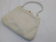 A beaded bag with lucite fittings