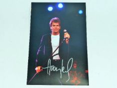 A hand signed Huey Lewis photograph as acquired by