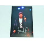 A hand signed Huey Lewis photograph as acquired by