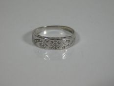 An 18ct white gold ring set with small diamonds 2.