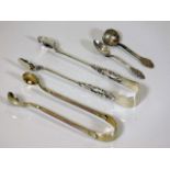 A silver gilt & enamel set of sugar tongs, one oth