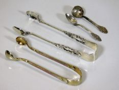 A silver gilt & enamel set of sugar tongs, one oth