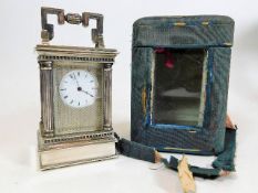 A French white metal carriage clock with carry cas