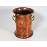 An arts & crafts style copper & brass wine holder