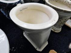A cream ceramic toilet The Repidus