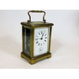 An antique French brass carriage clock