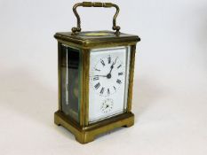 An antique French brass carriage clock