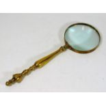 A brass mounted magnifying glass