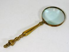 A brass mounted magnifying glass